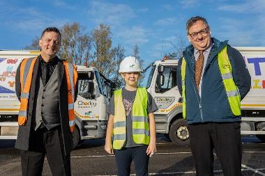 Competition winner Olivia with Christopher Greenwood, FCC Environment (left) and Councillor Adrian Lowe (right