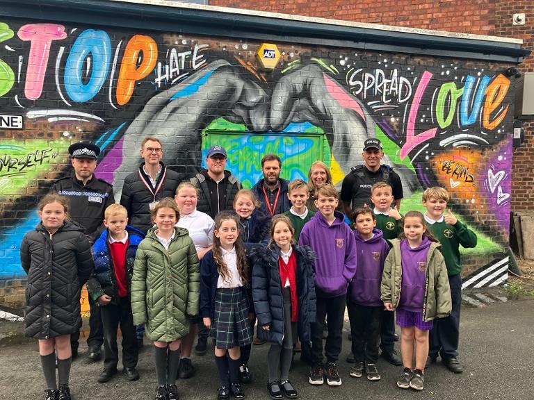 Winners, ward councillors, KingSyze Graffiti, and police at the mural in Coppull